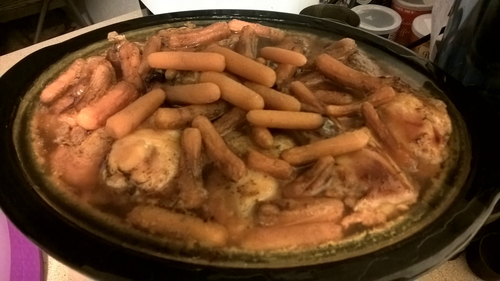 Overfilled crockpot of chicken soup