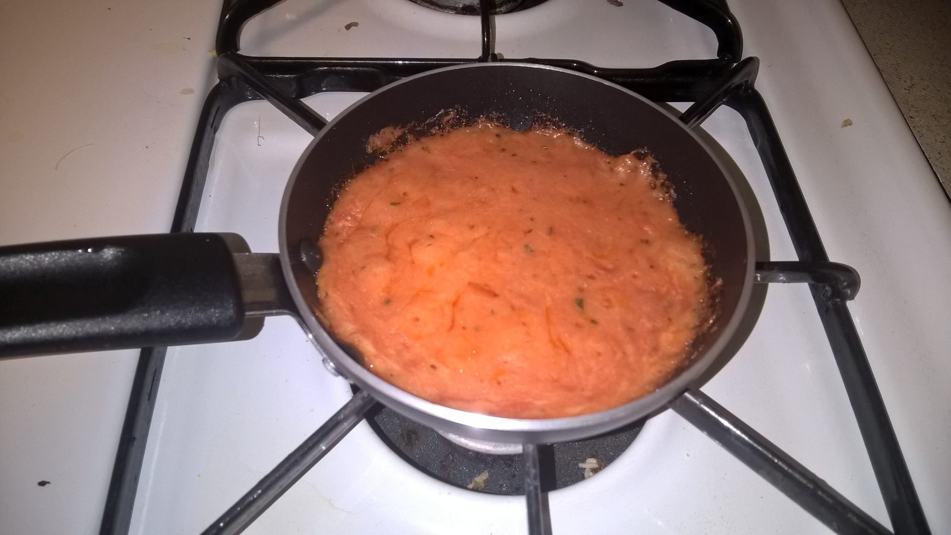 Bubbling cheese and tomato sauce mix.